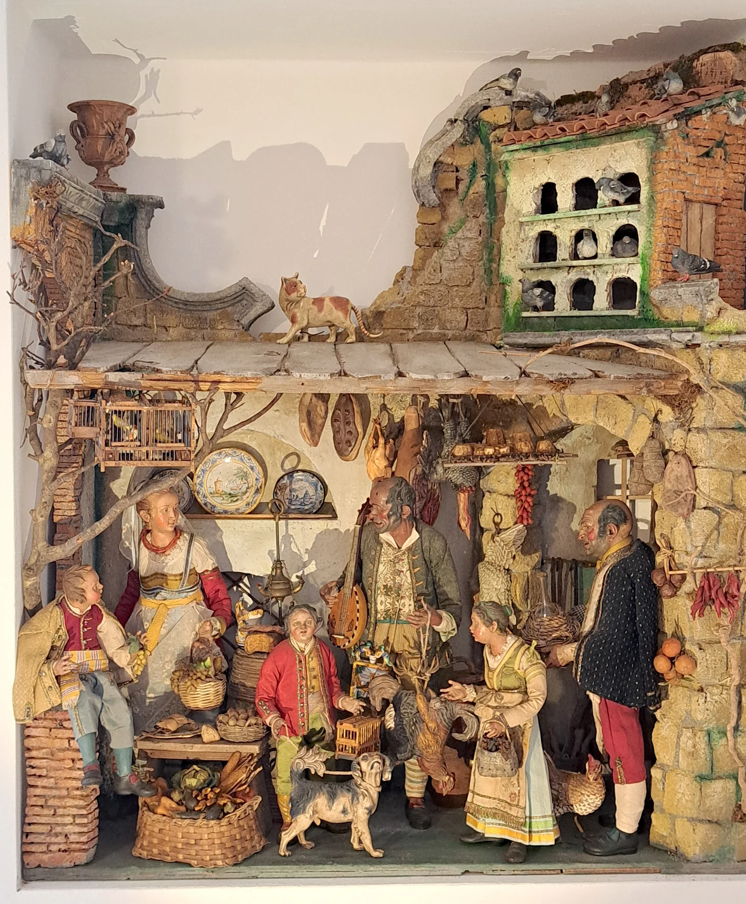 Una scenografia ispirata al presepe napoletano.